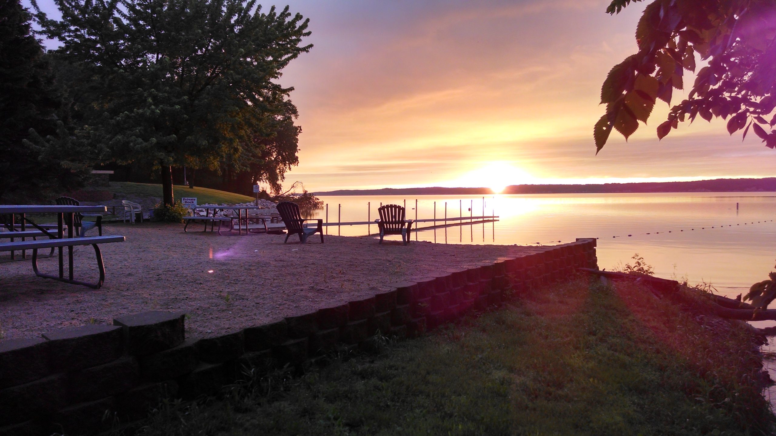 sunset on water from beach n dock